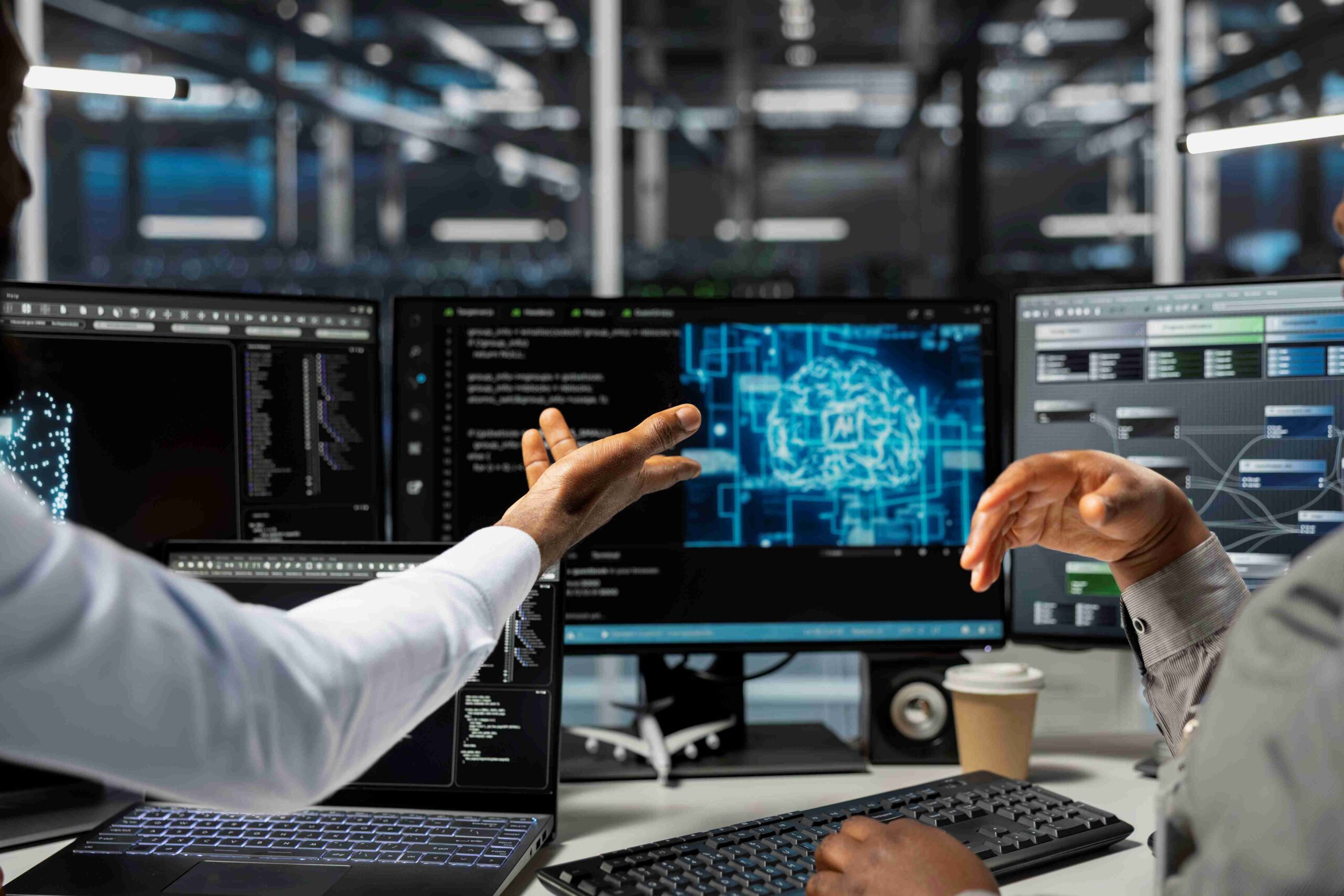 People discussing Cloud Platform Testing in server room