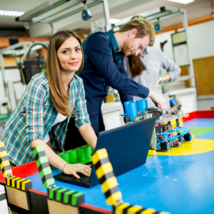 Engineers developing autonomous AI agents and agentic AI framework in robotics lab