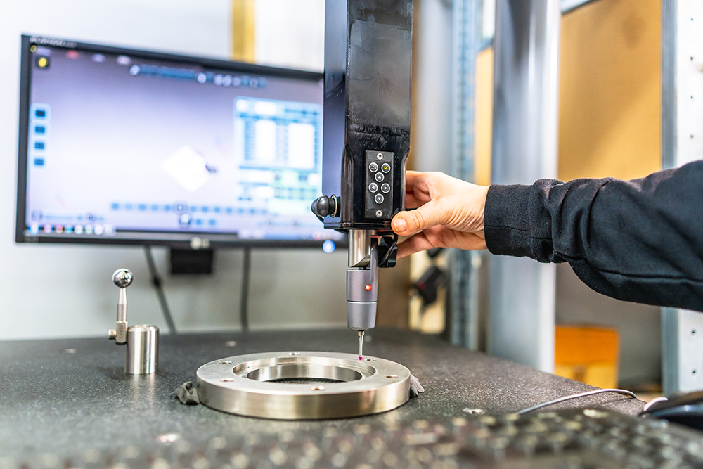 Engineer performing precision AI safety testing and quality assurance validation on hardware