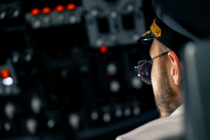 Pilot operating complex systems representing AI safety testing and responsible AI assurance