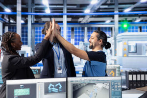 Team celebrating milestone in Industrial Automation facility