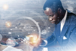 Businessman analyzing data metrics and percentages for Quality Maturity Assessment