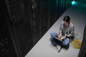 Lady on laptop assessing performance across workloads