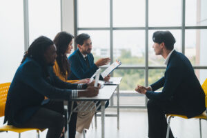 Panel interviewing a candidate in a modern office for Talent Recruitment