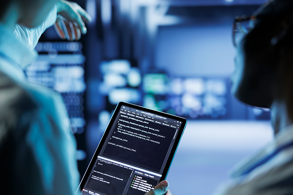 Engineers validating AI model testing and safety assurance on tablet in control room