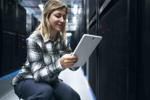 woman looking at cloud environment on tablet