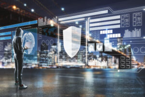 Person viewing digital security shield and data dashboards over a city skyline