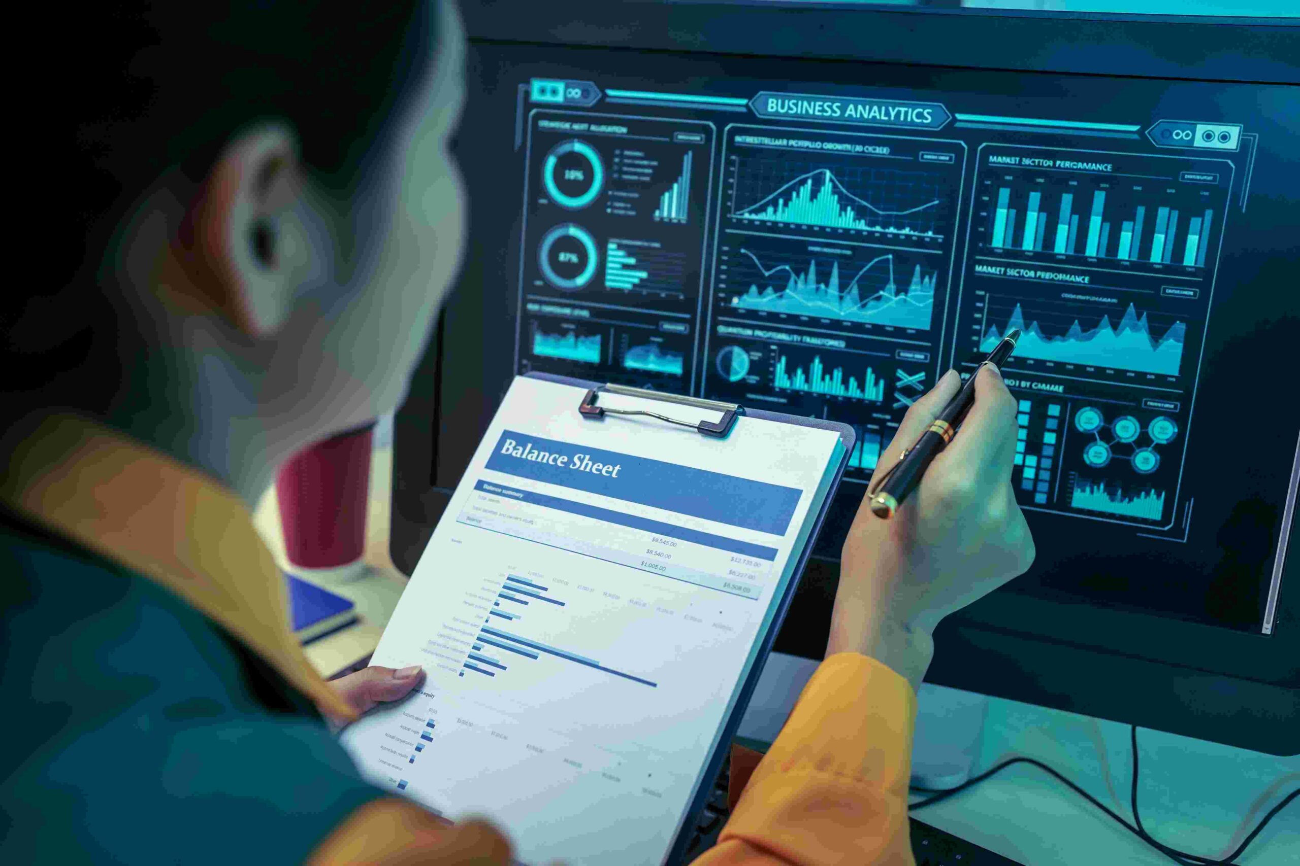 Person analyzing business analytics dashboard with balance sheet for Quality Intelligence Platform