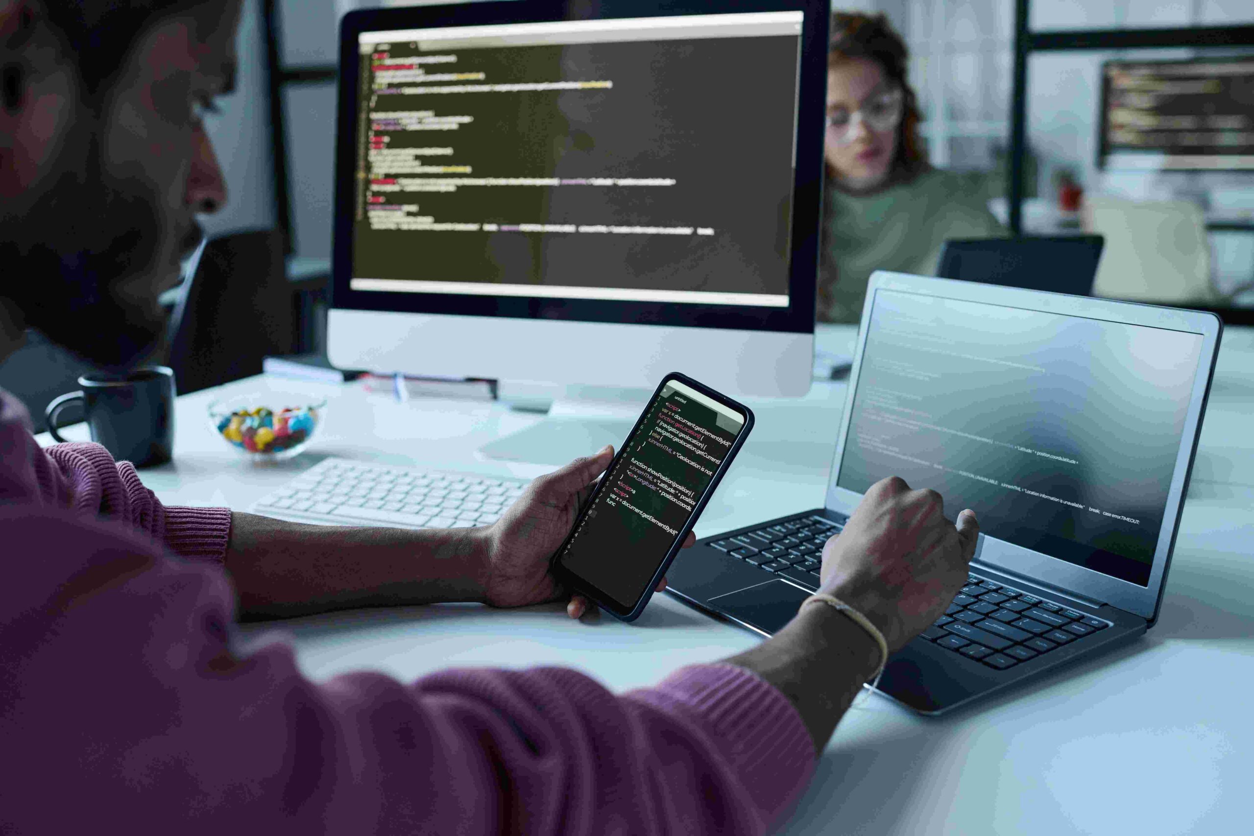 Developer reviewing code across devices
