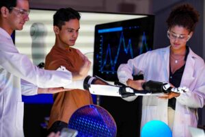 People testing robotic arm device