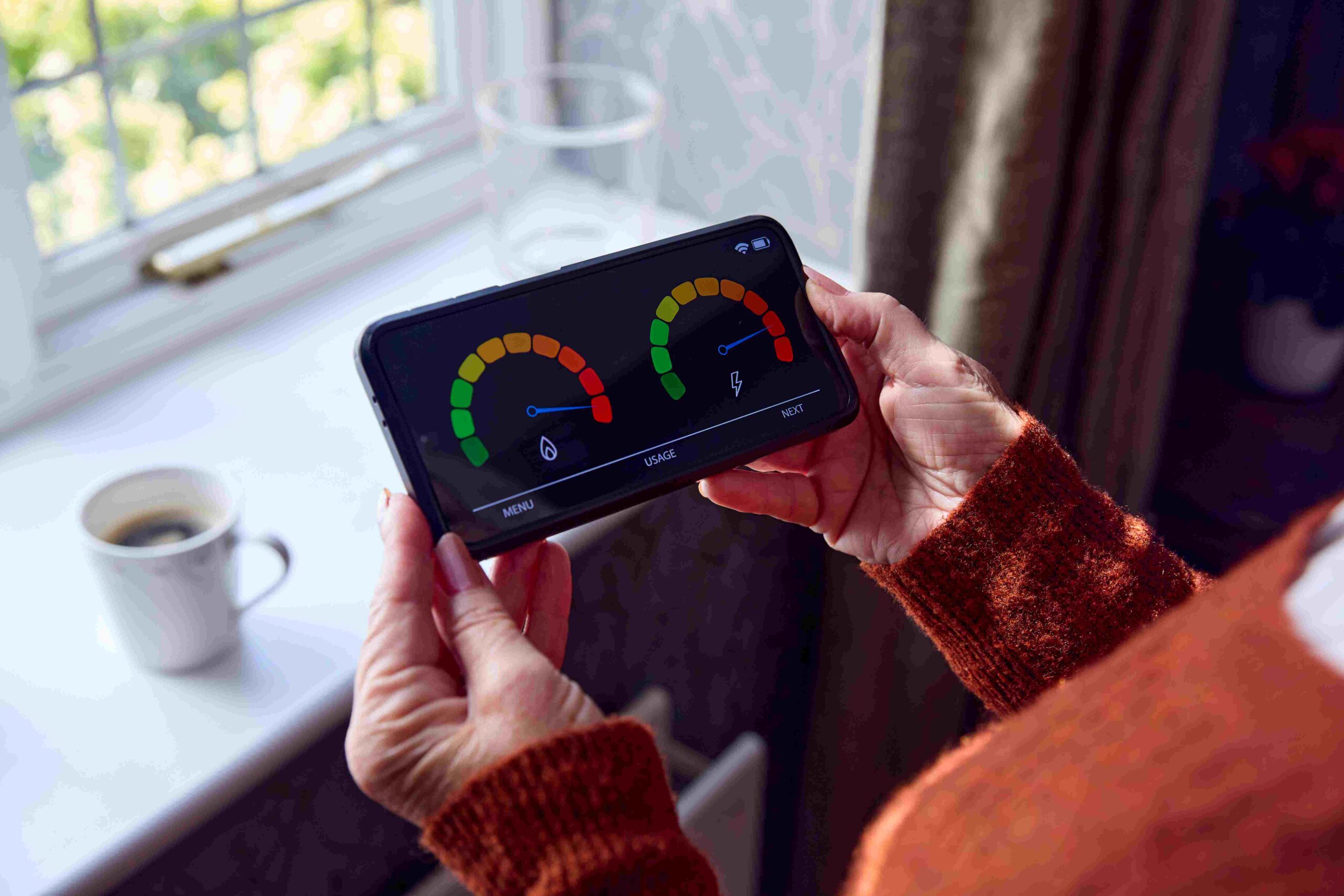 Person holding tablet with gauge readings