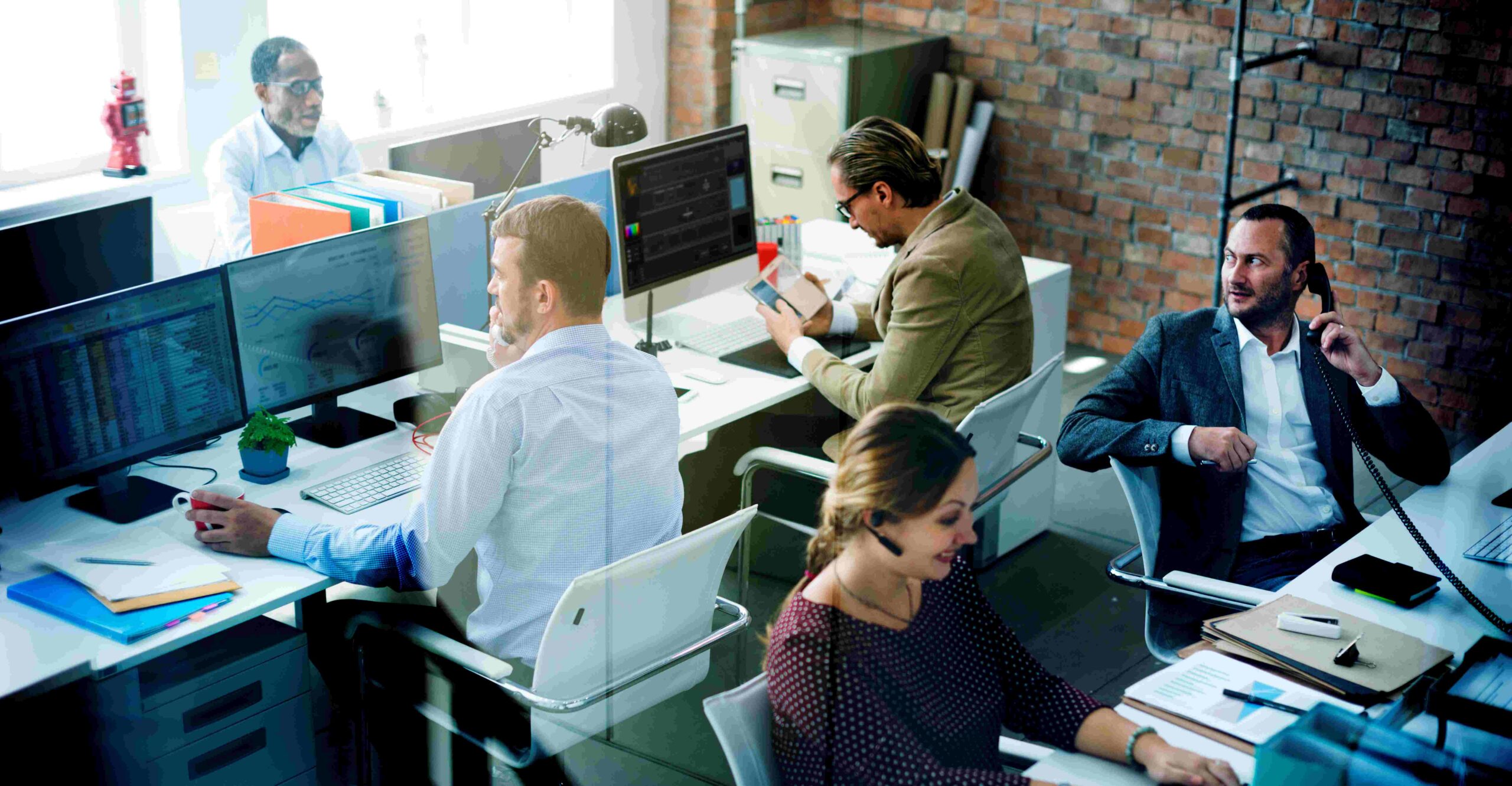 Team collaborating on CRM Testing in office