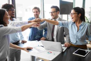 Team celebrating software testing partner success