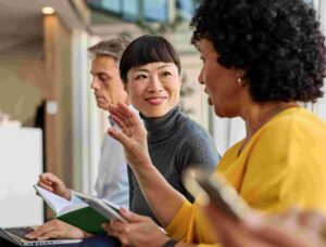 People discussing On-demand testing services in office