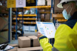 Person conducting dedicated QA team checks in warehouse