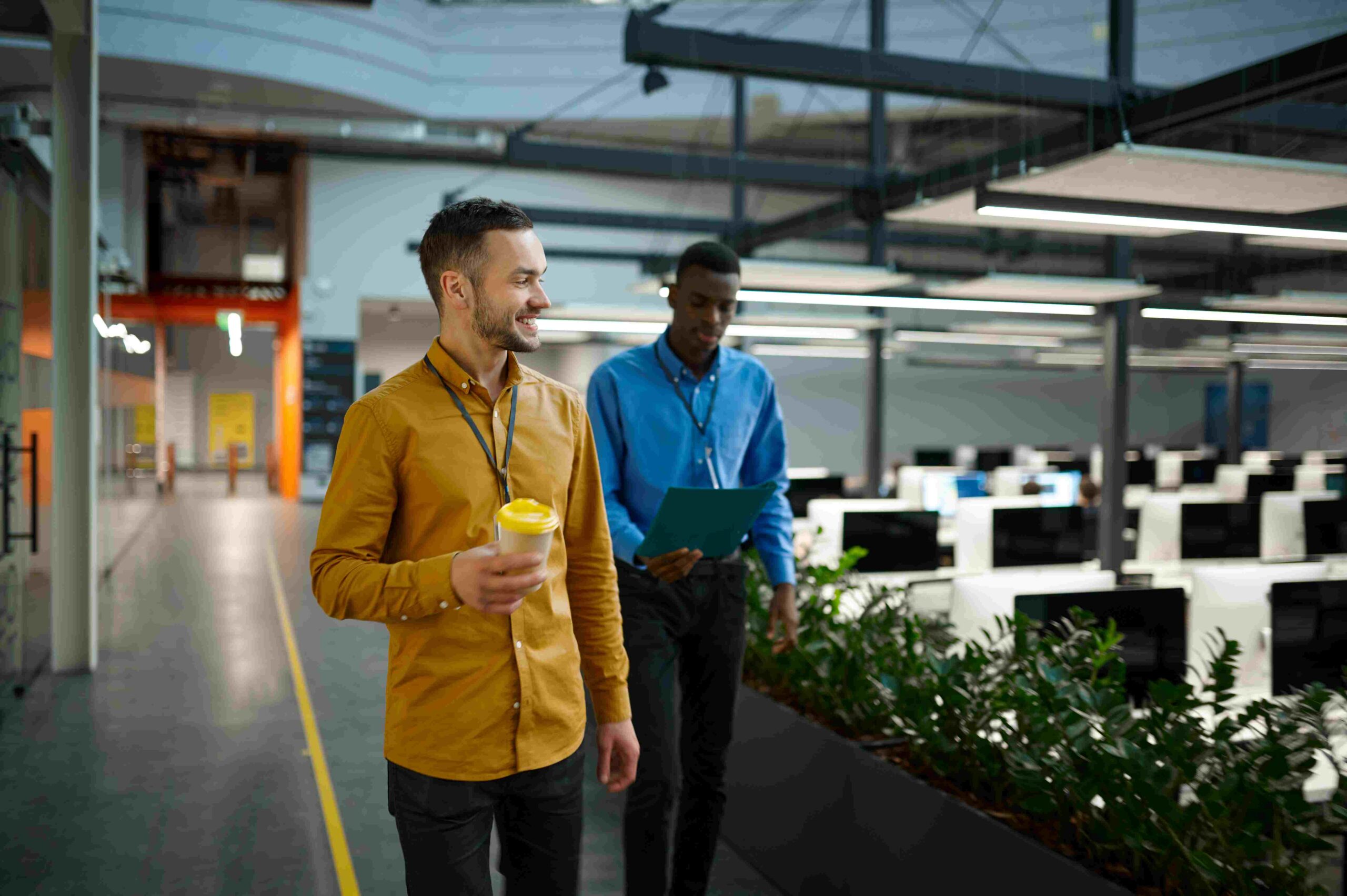 People discussing QC on Demand walking in office