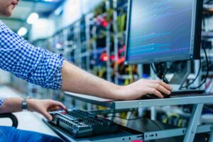 Technician working in server room