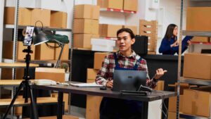 Person recording Testing as a Service tutorial in warehouse