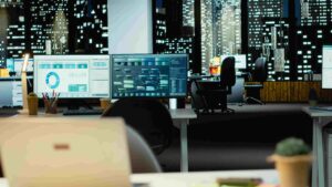 Empty desk with Synthetic data on monitors
