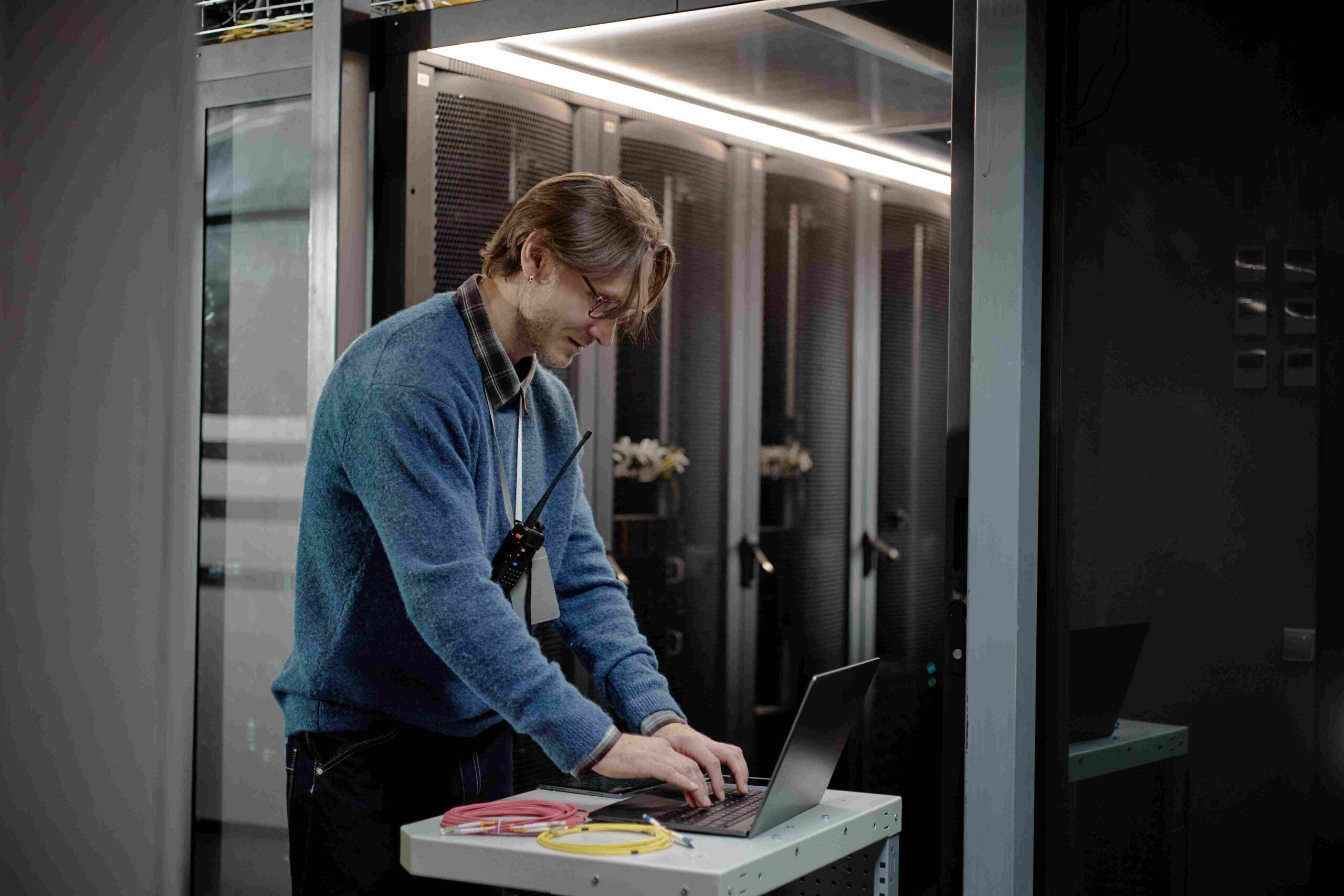 Person managing Synthesized test data platform in server room