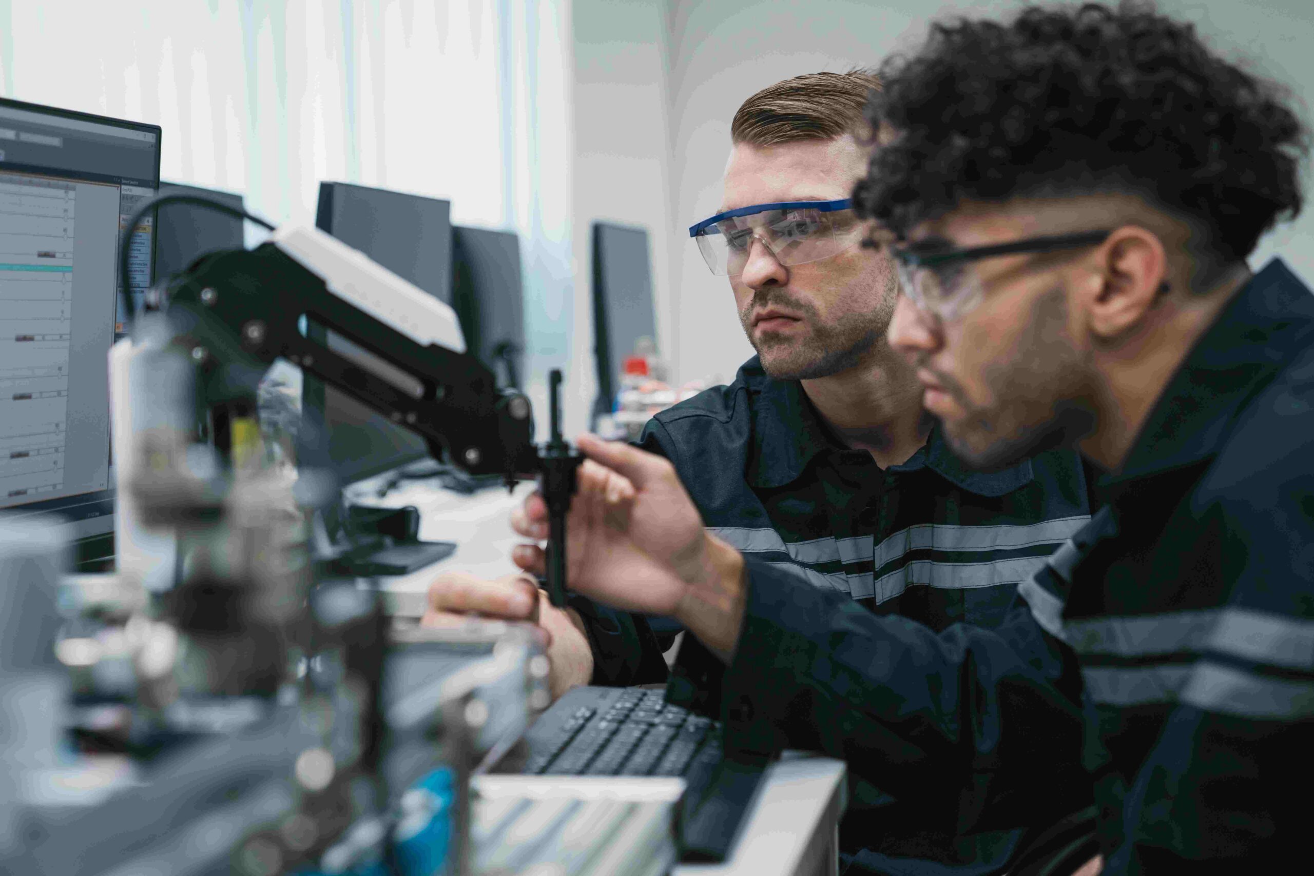 People conducting Veloce hardware testing in lab